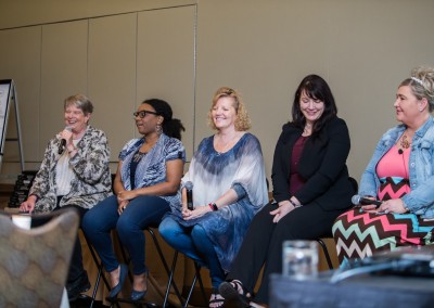 Five women talk on a panel at Women Who Test