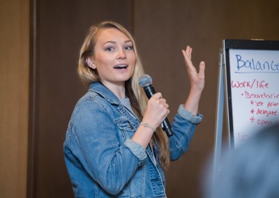 Woman addresses the audience at Women Who Test