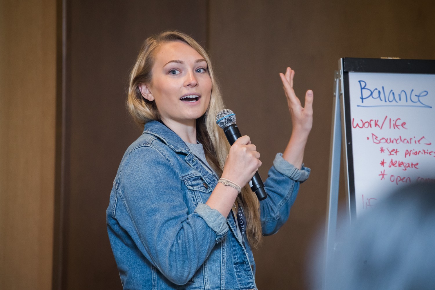 Woman addresses the audience at Women Who Test